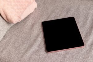 Tablet on textile sofa